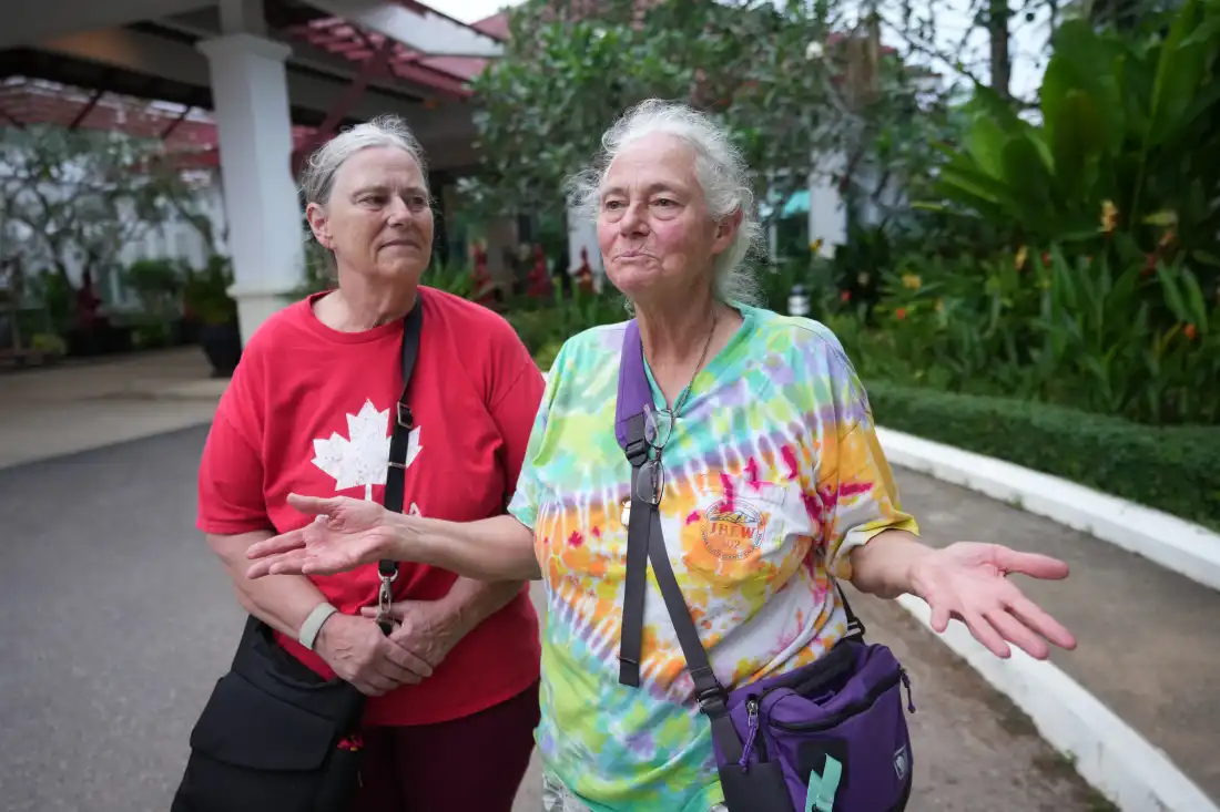 A sibling passenger from a U.S. cruise ship, the MV Odyssey, Carol Larson, 69, left, stands for an interview with her sister, Crystal Lavering, at the Independence Hotel in Sihanoukville, Cambodia, Wednesday, Oct. 28, 2026.
