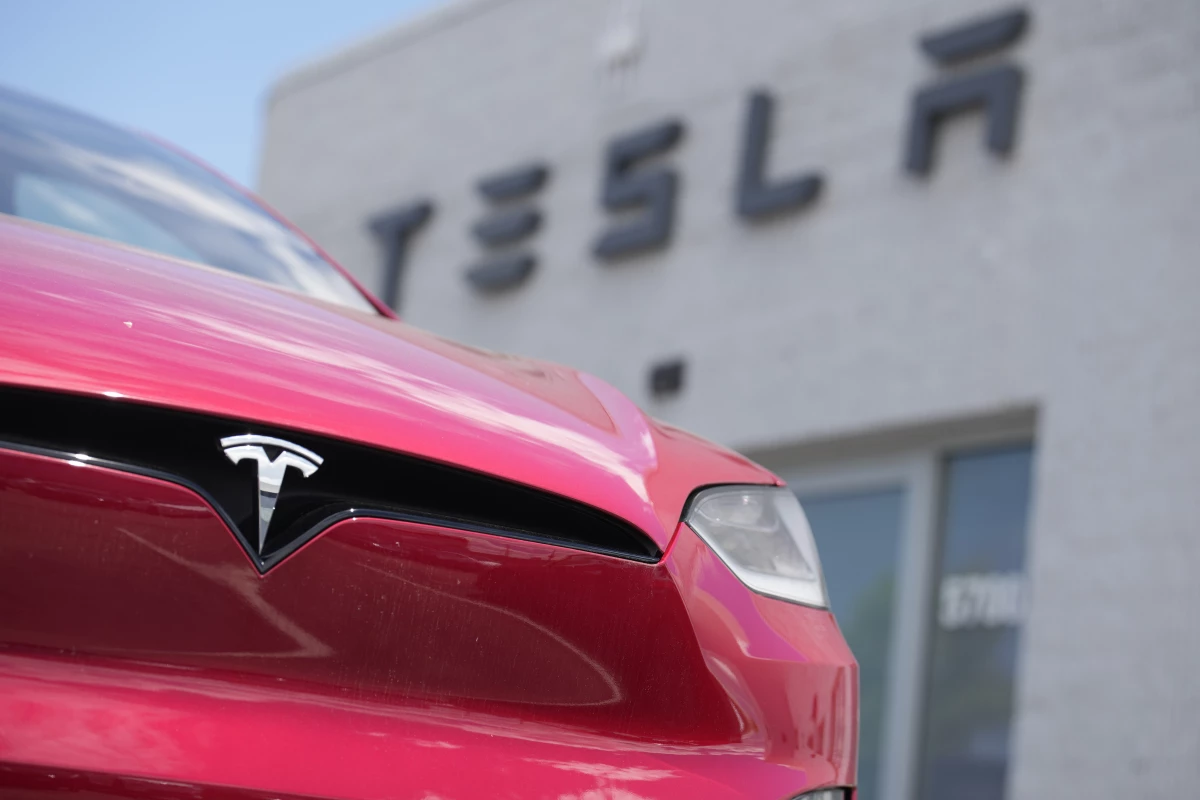 A 2023 Model X sports-utility vehicle sits outside a Tesla dealership Sunday, June 18, 2023, in Littleton, Colo.