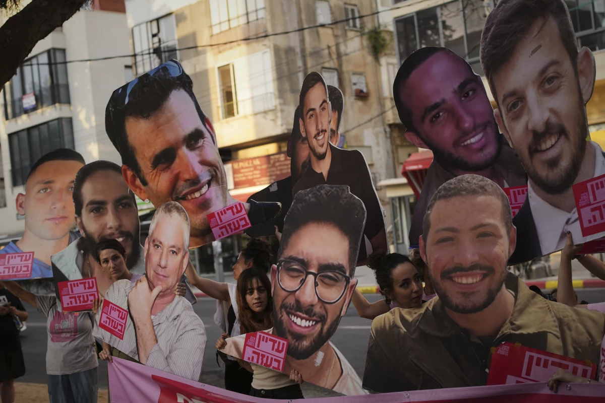 Relatives and supporters of Israeli hostages held by Hamas in Gaza display photos of the captives during a protest demanding their release. in Tel Aviv, Israel, on Saturday, June 21, 2025.