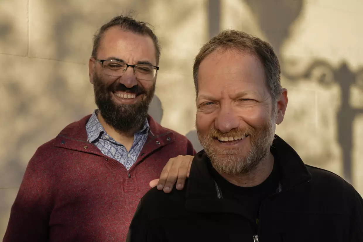 Aziz Abu Sarah (left) and Maoz Inon in Jaffa, Israel, in January. Their new book, <em>The Future Is Peace: A Shared Journey Across the Holy Land</em>, documents their peace activism that emerged from trauma and loss. Abu Sarah's brother died from injuries inflicted in Israeli custody and Inon's parents were killed by Hamas-led militants on Oct. 7, 2023.