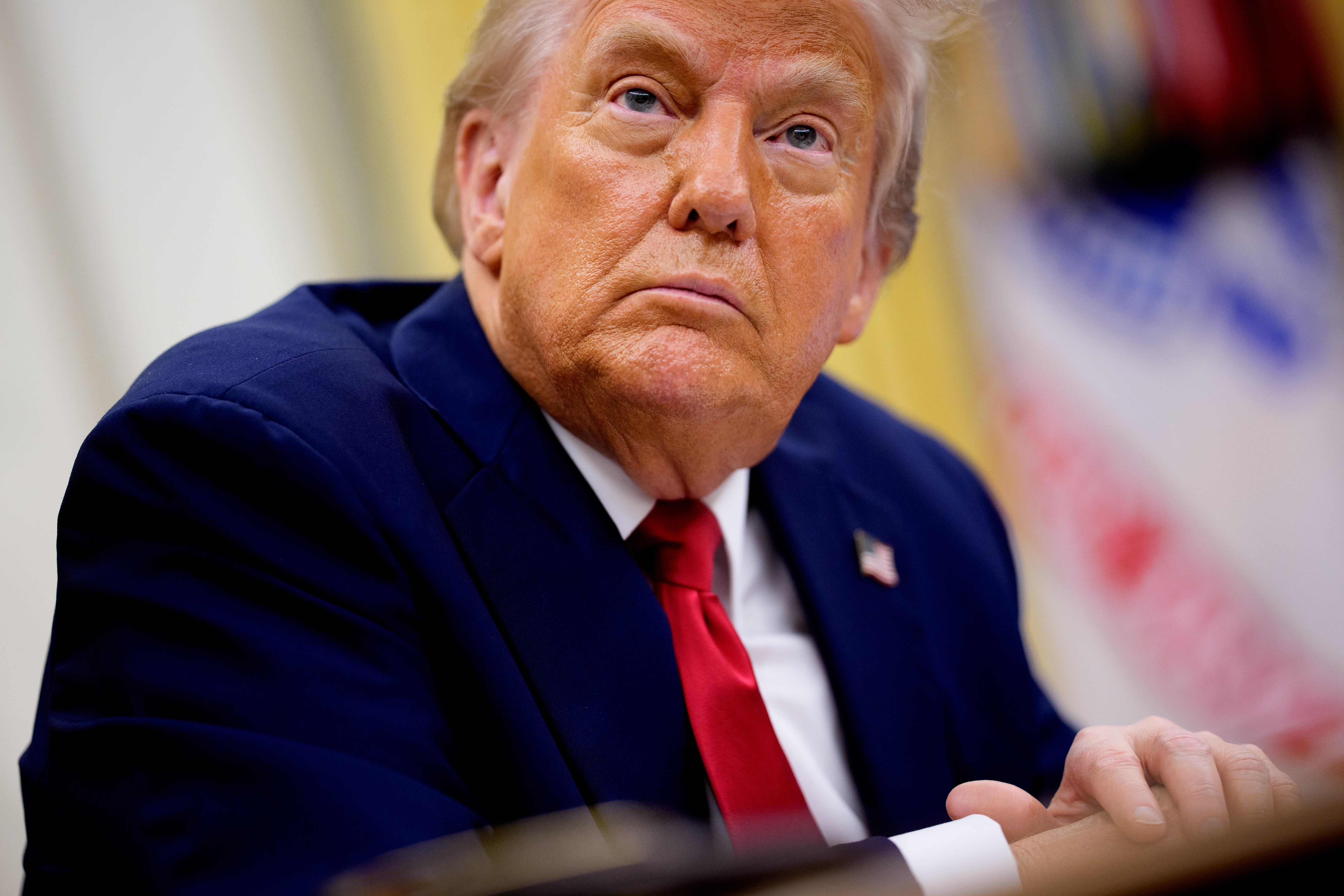President Trump takes questions from reporters during an event in the Oval Office of the White House on March 31, 2025.