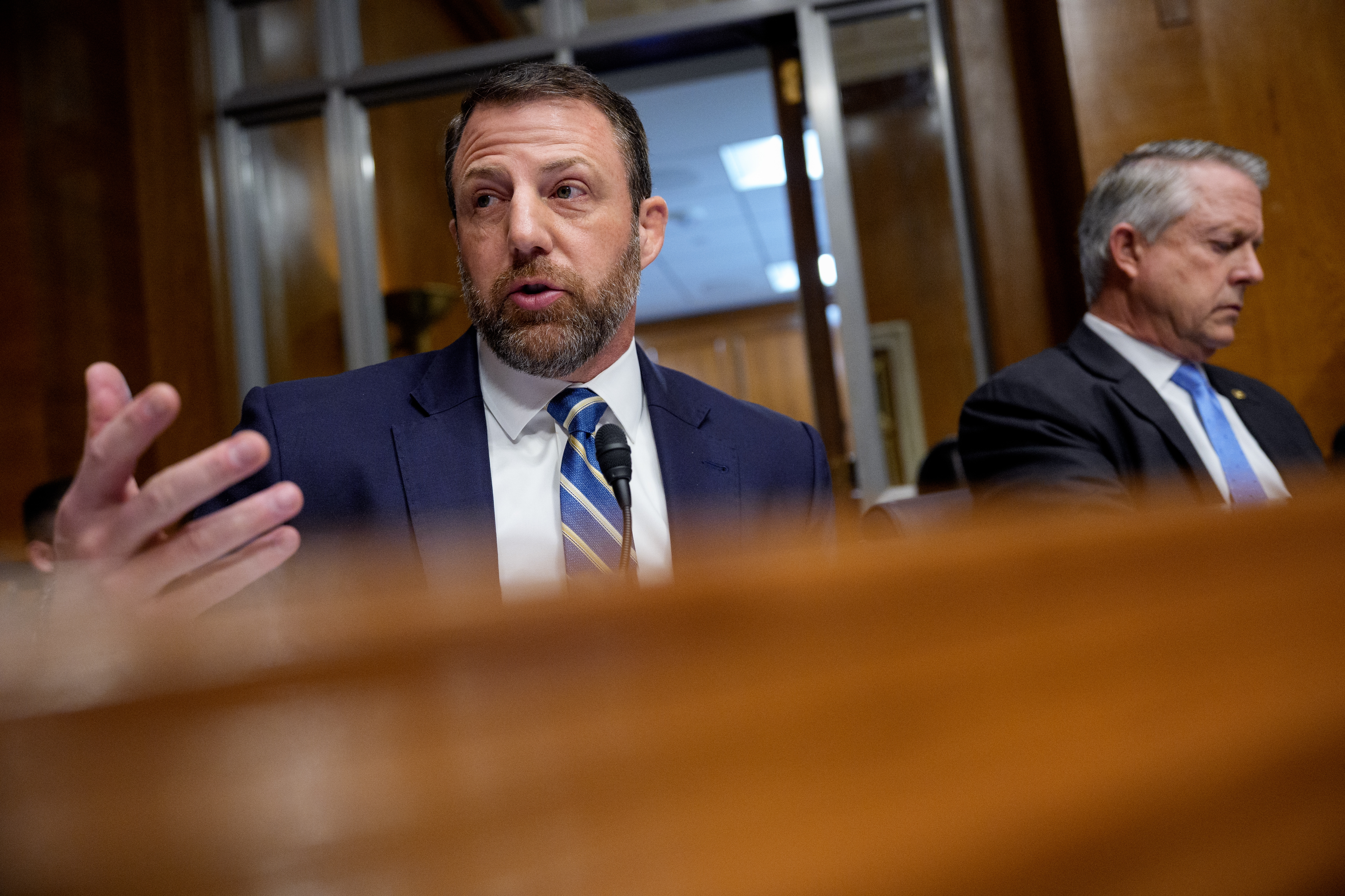 WASHINGTON, DC - FEBRUARY 25: Sen. Markwayne Mullin (R-OK) (L), accompanied by Sen. Roger Marshall (R-KS) (R), speaks during a nomination hearing for Dr. Casey Means, for the medical director in the Regular Corps of the Public Health Service and U.S. surgeon general during a Senate Health, Education, Labor and Pensions Committee hearing on Capitol Hill on February 25, 2026 in Washington, DC. Means, a health influencer, will make her case to be the next surgeon general. (Photo by Andrew Harnik/Getty Images)