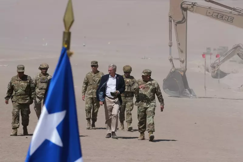 Chilean President Jose Antonio Kast walks past diggers along the northern border at the Chacalluta border crossing in Arica, Chile, March 2026.