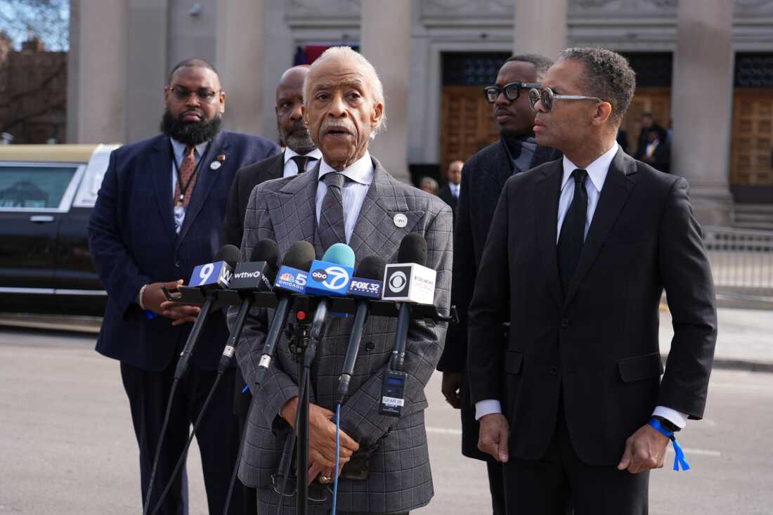 The Rev. Al Sharpton speaks as Jesse Jackson Jr. listens after the public visitation for the Rev. Jesse Jackson at Rainbow/PUSH Coalition in Chicago on Thursday.