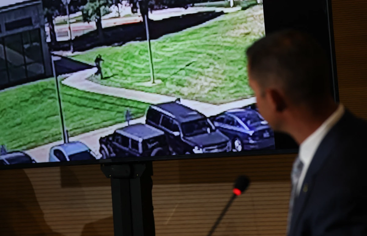 Utah Department of Public Safety Commissioner Beau Mason plays a video of a person of interest during a press conference on Thursday.