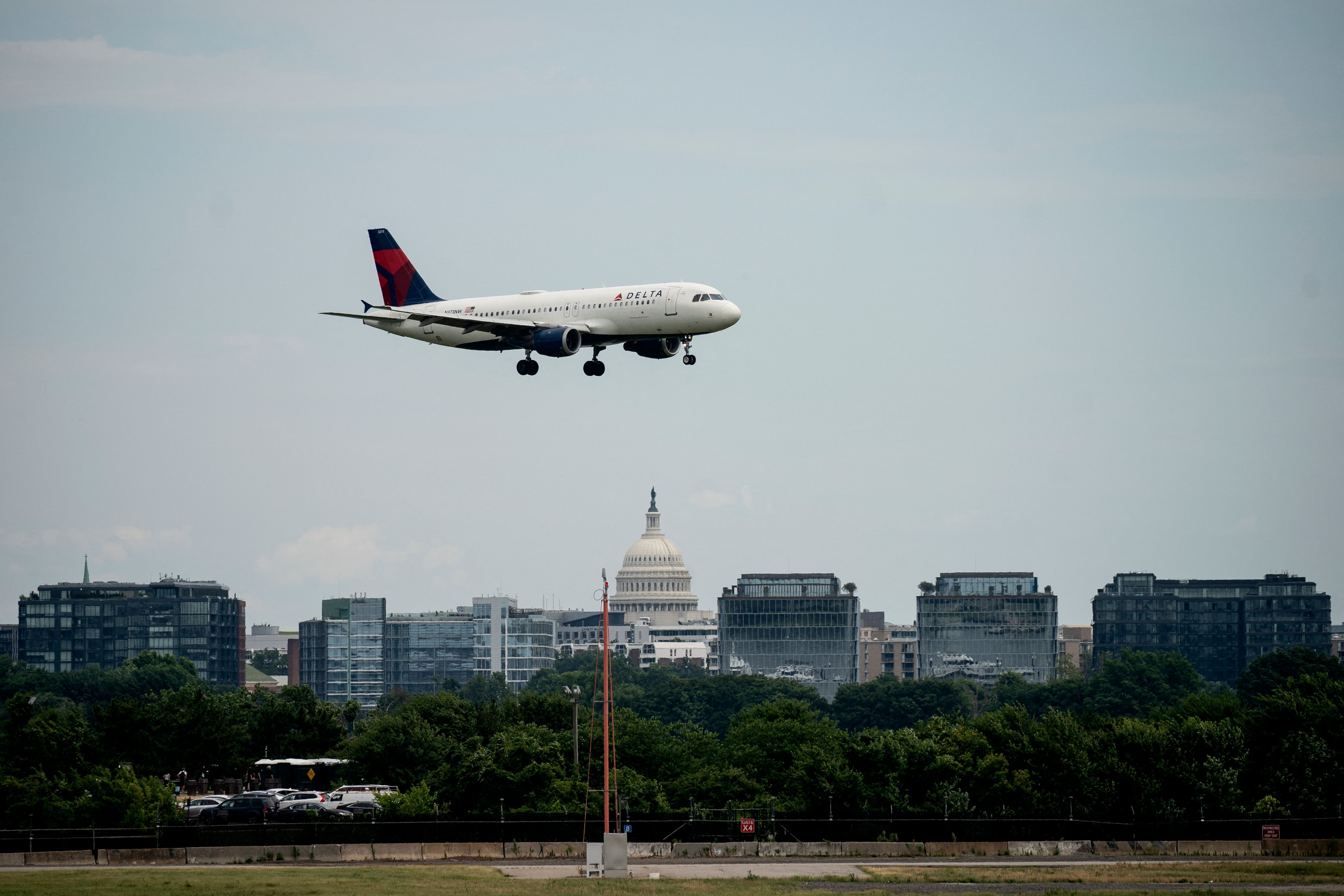 A Delta Air Lines flight approaches Ronald Reagan Washington National Airport in Arlington, Va., on July 2, 2022. On Thursday, two commercial jetliners had to abort landings this week at the airport because of an Army Black Hawk helicopter.