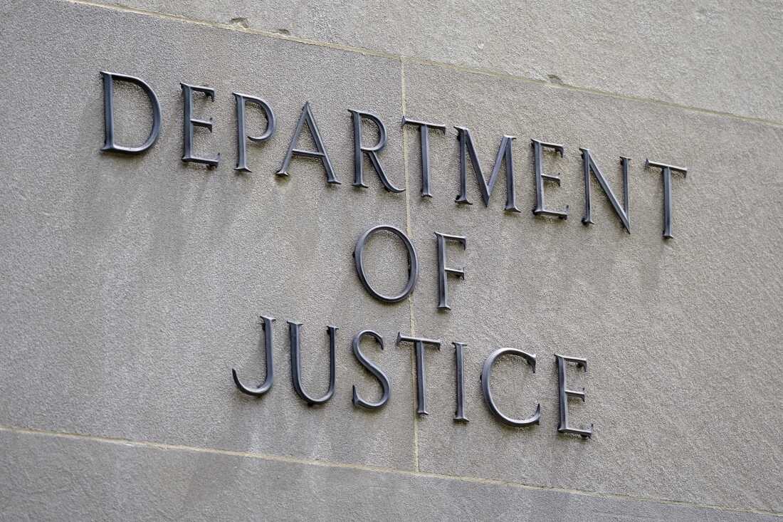 A sign outside the Robert F. Kennedy Department of Justice building is seen in Washington, May 4, 2021. Two former FBI officials settled lawsuits Friday, July 26, 2024, with the Justice Department to resolve claims that their privacy was invaded when the department disclosed to the news media text messages they sent to each other that were derogatory toward former President Donald Trump. (AP Photo/Patrick Semansky)