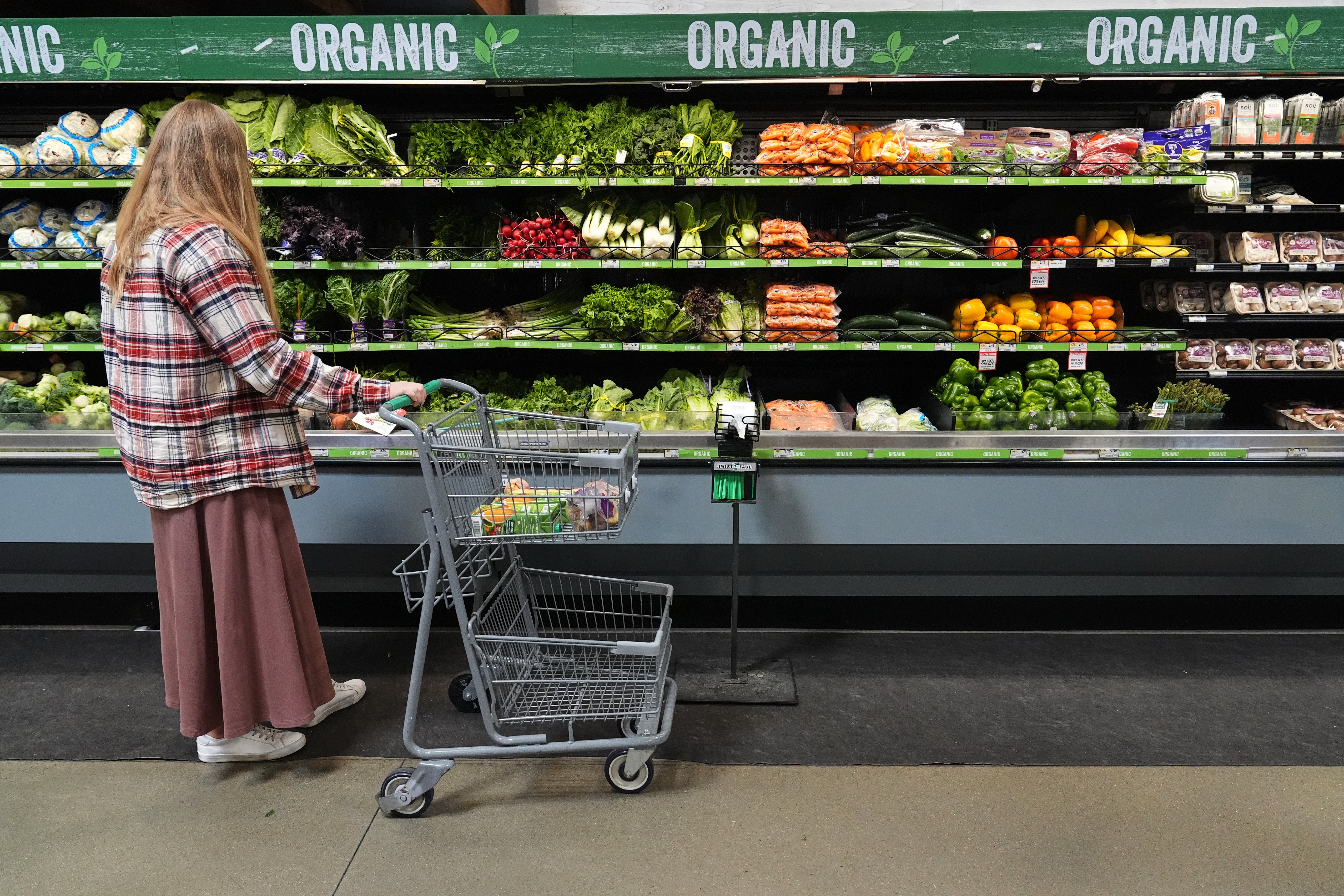 A person shops for produce, which is covered by the USDA Supplemental Nutrition Assistance Program (SNAP), at a grocery store Monday in Baltimore.