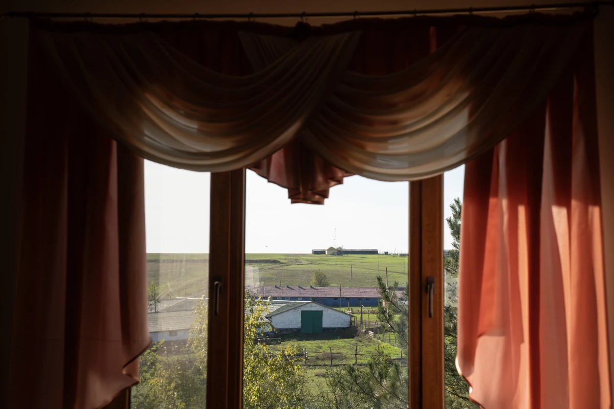 Livestock and winemaking facilities viewed through a window in Frumushika-Nova, Ukraine, on Oct. 25, 2024. The complex,  made up of a hotel, restaurant, statue garden, winery and conference center, was created by Oleksandr Palariev, a winemaker, naturist and entrepreneur.