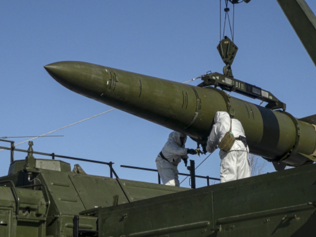 In this photo released by Russian Defense Ministry Press Service on Friday, Feb. 2, 2024, Russian troops load an Iskander missile onto a mobile launcher during drills at an undisclosed location in Russia.