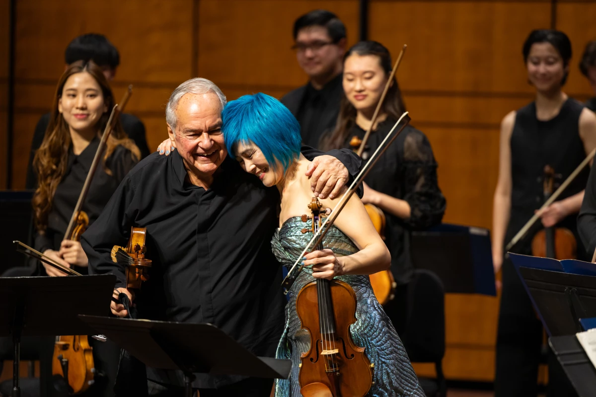 Jennifer Koh, right, featured her distinguished mentor Jaime Laredo, left, last season at the Kennedy Center in Washington, D.C. for a concert featuring double concerti for two violins, an extension of her 'Two X Four' project highlighting connections between teacher and student.