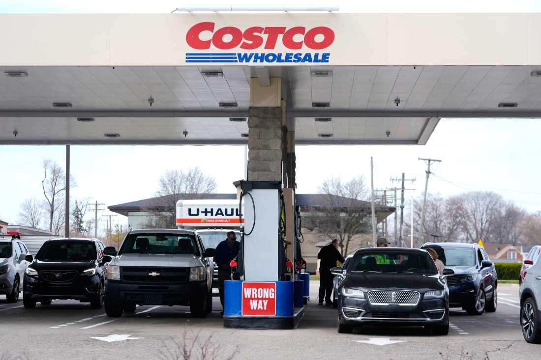 Drivers fuel up at a Costco gas station in Roseville, Mich.