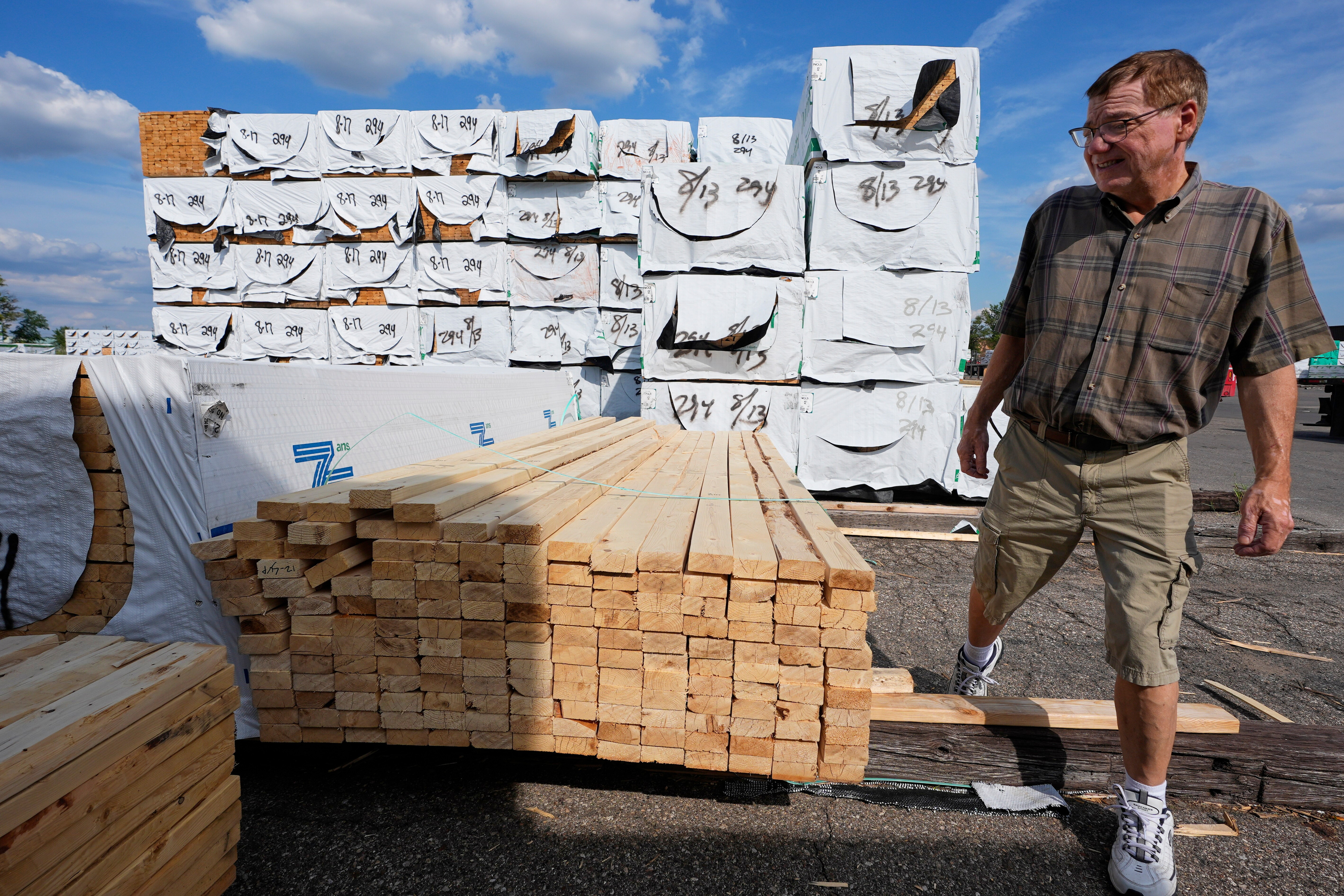 Mel Gutherie, president of Gutherie Lumber, walks among Canadian lumber products on Aug. 25 in Livonia, Mich.