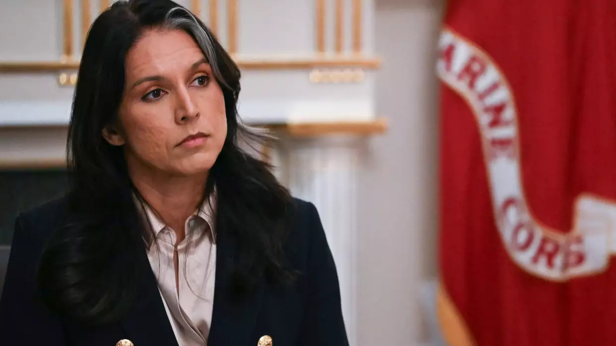 Director of National Intelligence Tulsi Gabbard listens as President Trump speaks during a Cabinet meeting at the White House on Dec. 2, 2025.