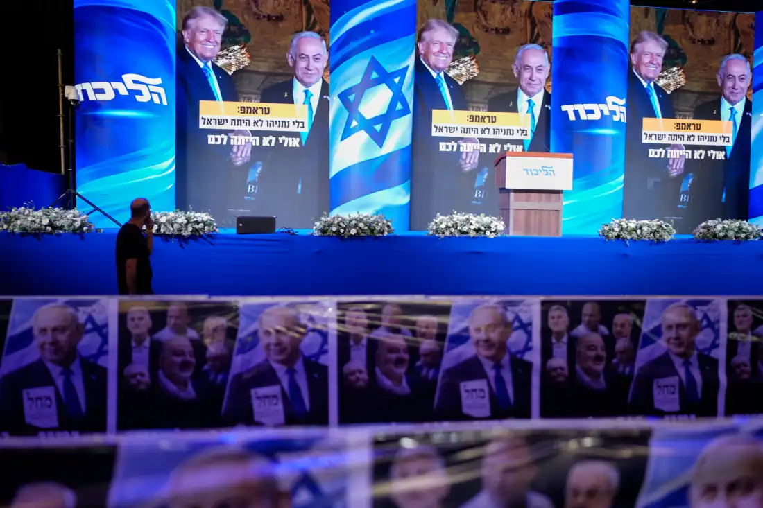 A video wall displays images of Benjamin Netanyahu with President Trump at a Likud party event before the release of the first exit poll results in Israel's general election, in Jerusalem, on Tuesday.