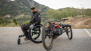 Marshall Evans next to his adaptive bike after riding Canyon Rim Trail at Snowbasin Resort, Sept. 10, 2026.