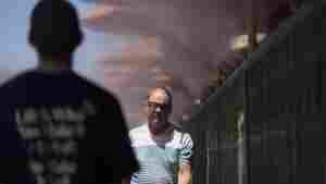 People walk through cooling misters on June 4, 2024 in Las Vegas.
