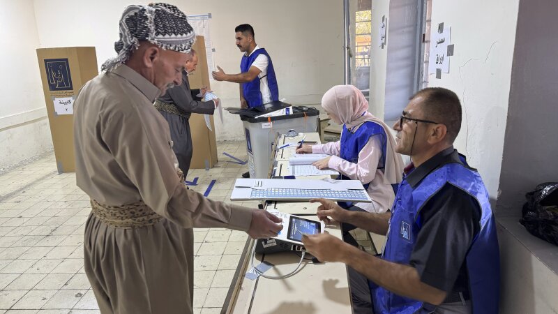 A man registers to vote during parliamentary elections of Iraq’s semi-autonomous northern Kurdish region in Irbil on Sunday.