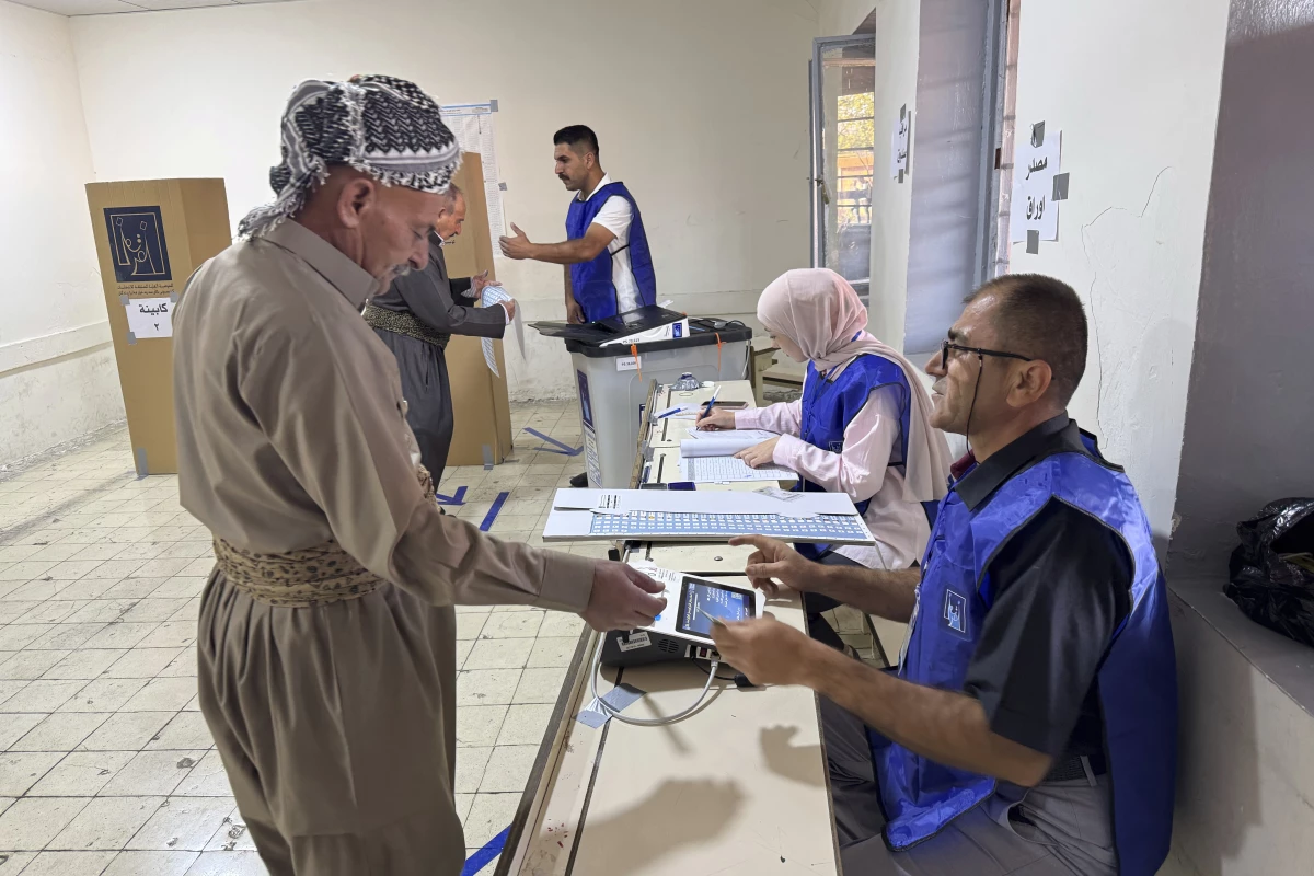 A man registers to vote during parliamentary elections of Iraq’s semi-autonomous northern Kurdish region in Irbil on Sunday.