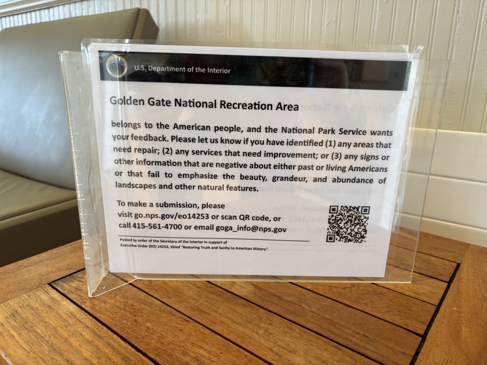 Signs like this one in the Presidio of San Francisco, part of the Golden Gate National Recreation Area, have been going up around the country in response to President Trump's executive order titled "Restoring Truth and Sanity to American History." (NPR)