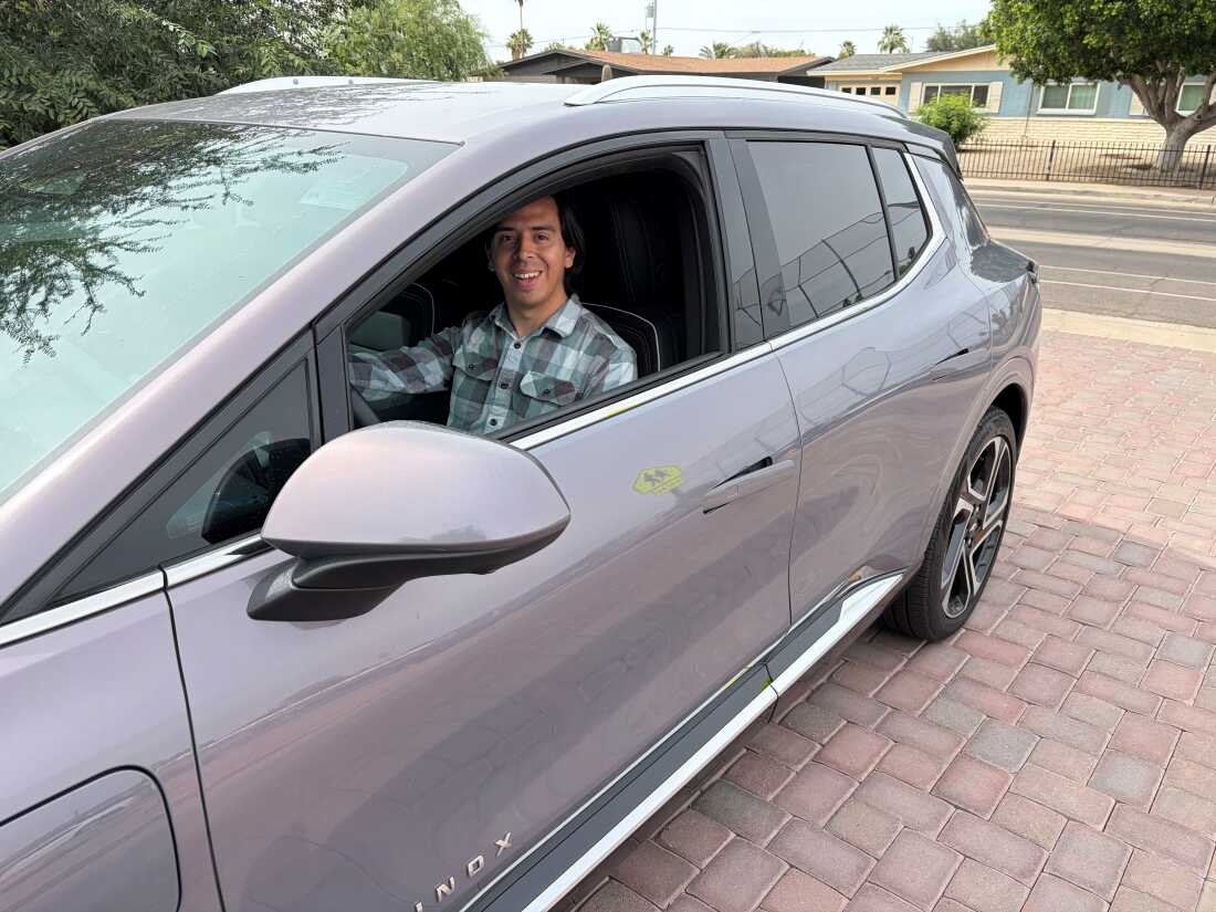 Guadalupe Higuera behind the wheel of his 2025 Chevrolet Equinox EV in Phoenix, Ariz.