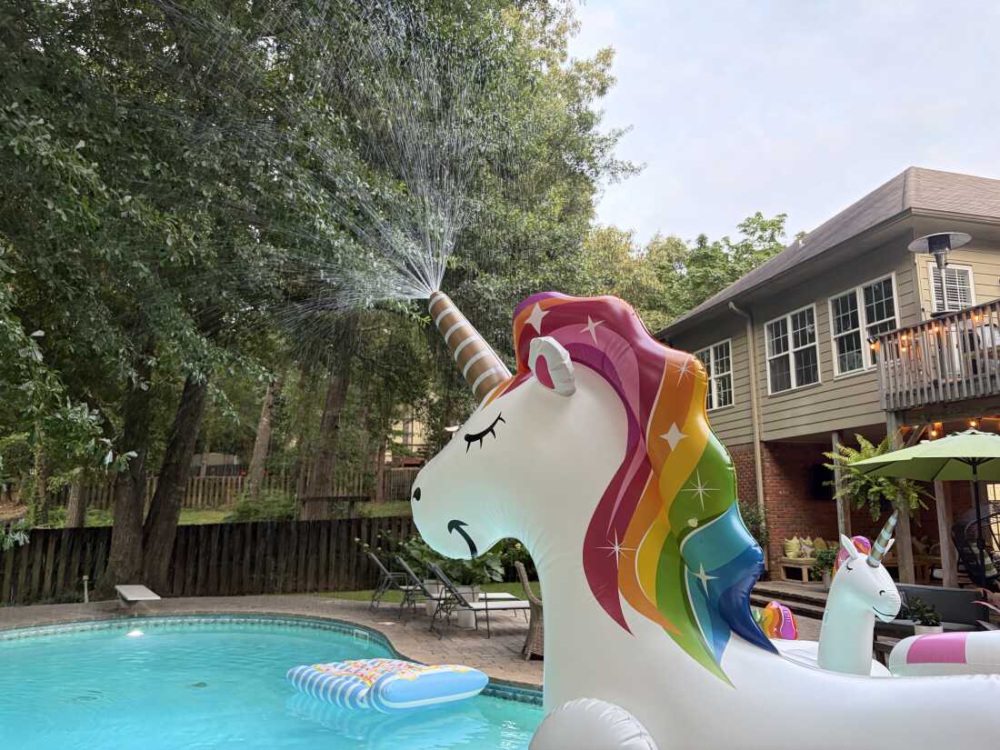 A unicorn inflatable sprinkler sprays water across Jasmine Lawson’s pool in Birmingham, Ala. on June 24, 2026.