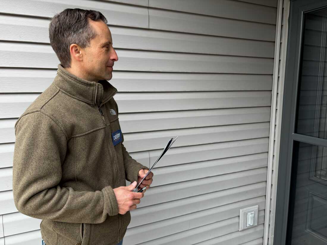 Indiana authorities Sen. Spencer Deery waits to speak to a elector arsenic he goes door-to-door campaigning for re-election up of Indiana's superior wherever he faces a President Trump-backed challenger and millions spent to conclusion him and different Republicans who voted against redistricting successful the state.