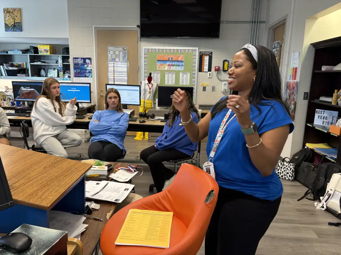 AP Business with Personal Finance teacher Gerri Kimble talks with students about their part time jobs and saving their earnings at Hoover High School on October 6, 2026.