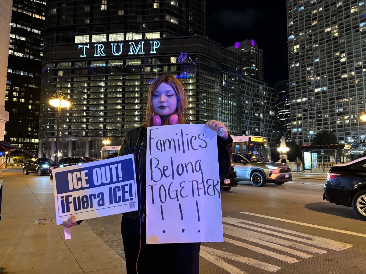 Jessica Urbina, a 26-year-old college student, poses in front of the Trump International Hotel and Tower on Oct. 8.