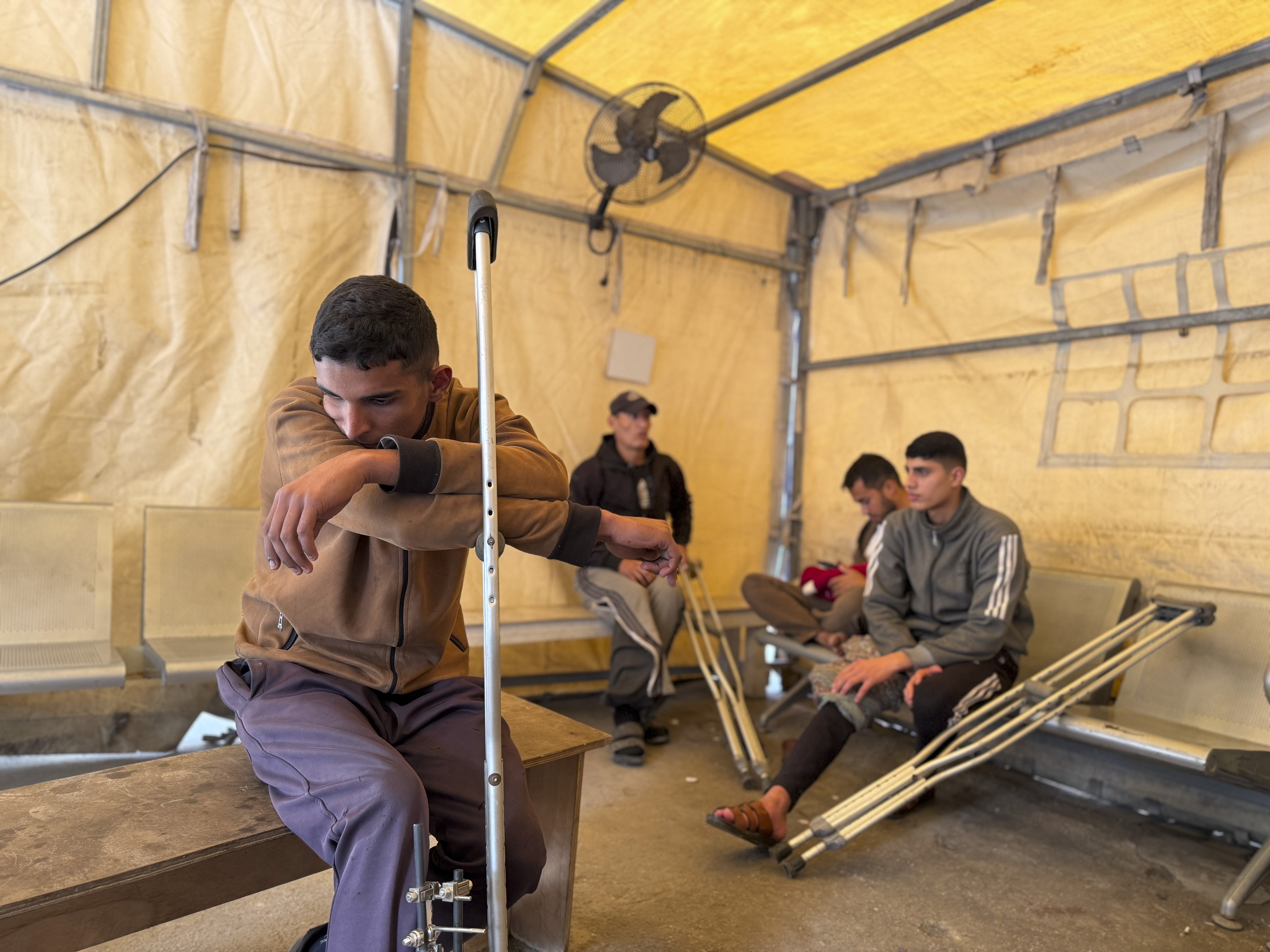 Patients sit in a clinic in Gaza City run by Doctors Without Borders, known by its French initials MSF, on Dec. 31, 2025.