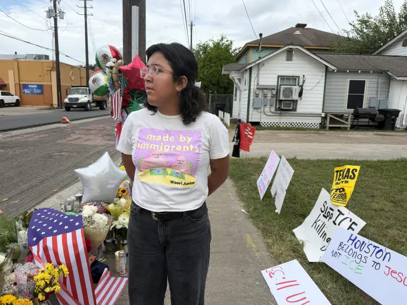 Immigrant-rights activist Esmeralda Ledezma looks over the makeshift memorial for Lorenzo Salgado Araujo, a 52-year-old man shot by immigration agents in Houston.