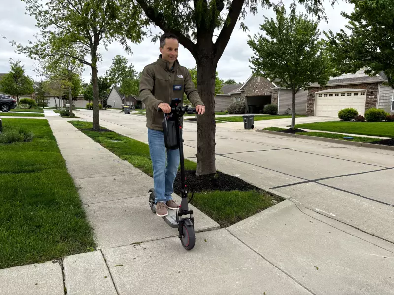 Indiana state Sen. Spencer Deery rides his electric scooter to canvass neighborhoods in his districts ahead on April 28 of Indiana's primary election.