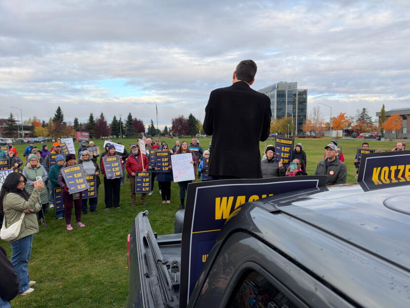 Rev. Matt Schultz speaks to a crowd of about 100 people at Delaney Park Strip in Anchorage who are protesting President Donald Trump and his administration, Tuesday, Oct. 13, 2026.