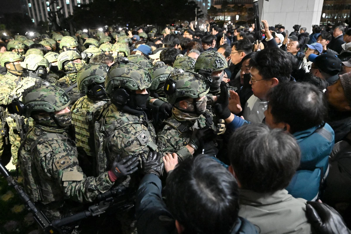 Soldiers try to enter the National Assembly building in Seoul earlier this week after South Korean President Yoon Suk Yeol declared martial law.