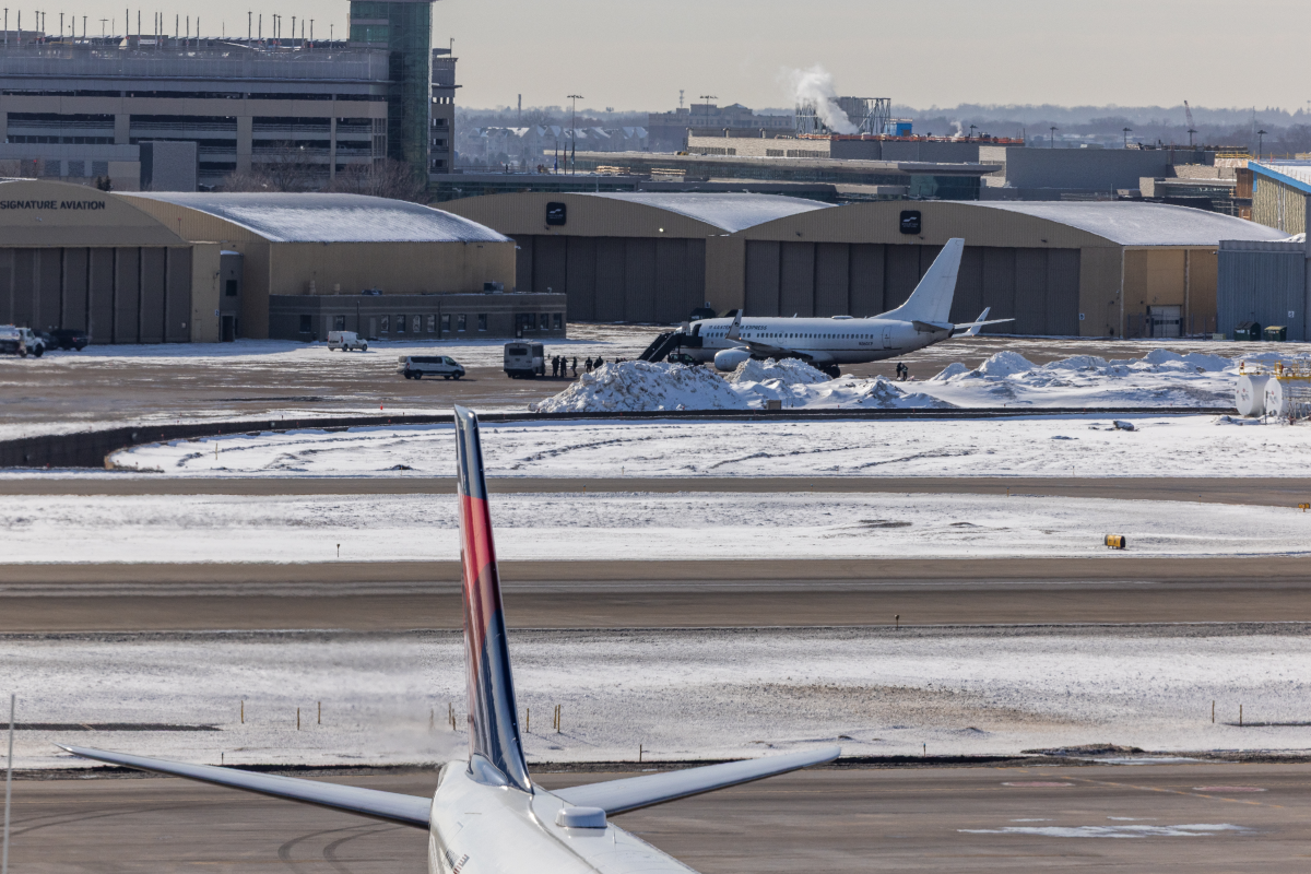 Nick Benson tracks deportation flights departing daily from Minneapolis–St. Paul International Airport in Minneapolis on Feb. 3, 2026, amid Operation Metro Surge, the largest immigration enforcement operation in U.S. history.