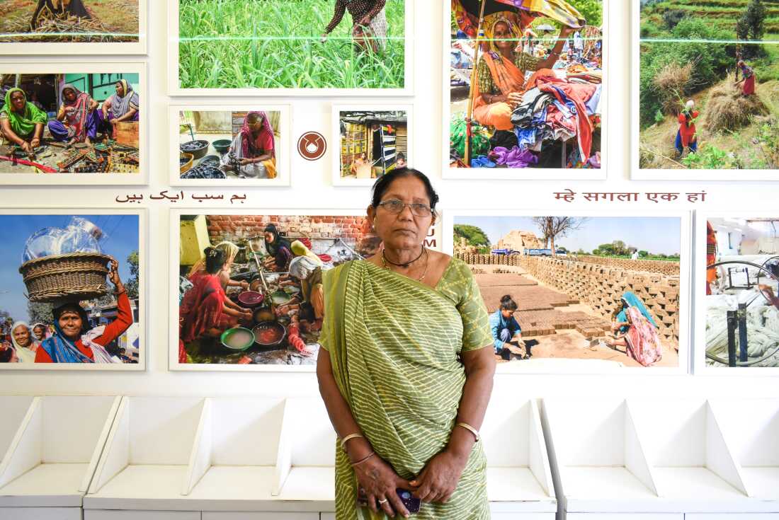 Laxmiben Nadia stands inside SEWA's office.