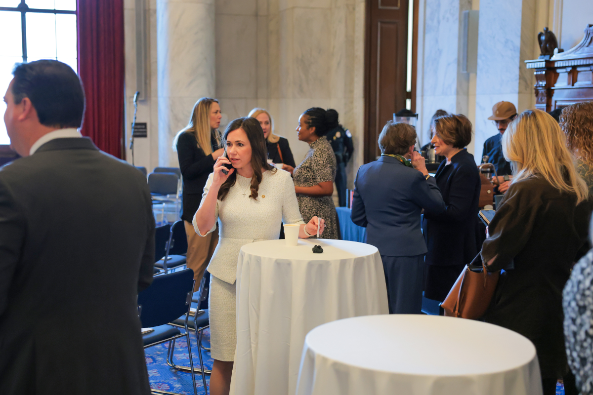 Britt speaks on the phone at the National Prayer Breakfast in the Kennedy Caucus Room on Capitol Hill on Feb. 05. Britt says her constituents sent her to Washington to find compromise. 'Anybody can go sit in a corner,' she says.