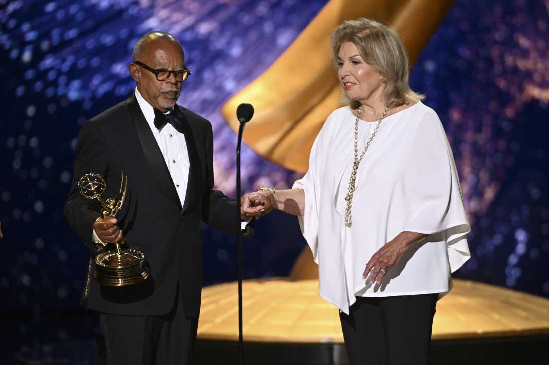 Patricia Harrison (right) accepts the Governor's Award on behalf of the Corporation for Public Broadcasting (CPB) from Henry Louis Gates Jr. during the 2025 Emmy Awards presented by the Television Academy for the Creative Arts on September 7, 2025.