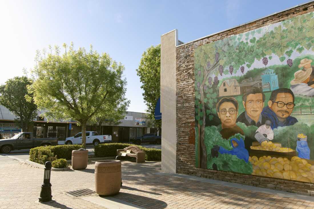 A mural depicting civil rights icon Cesar Chavez, along with other leaders of the farm labor movement in downtown Delano, Calif. on March 29. In the fallout of the sexual abuse allegations against Chavez, many landmarks are under review to be renamed and his likeness is being taken down across California.