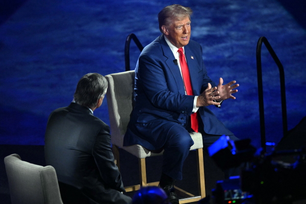 Former president and Republican presidential candidate Donald Trump takes part in a town hall moderated by Fox News broadcaster Sean Hannity at the New Holland Arena in Harrisburg, Pa. on Wednesday.