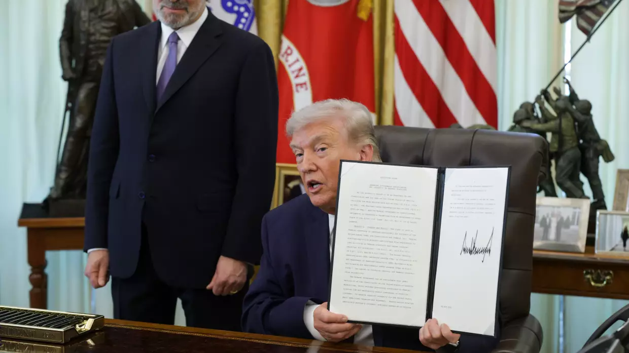 President Trump holds up an executive order to limit mail-in voting as Commerce Secretary Howard Lutnick looks on in the White House's Oval Office in March.