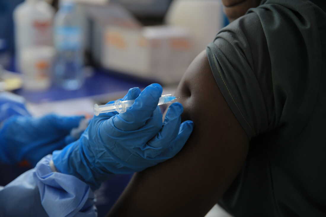 A health care worker administers a dose of Ervebo vaccine against the Ebola virus in Beni, North Kivu province, eastern Congo, on Oct. 16.