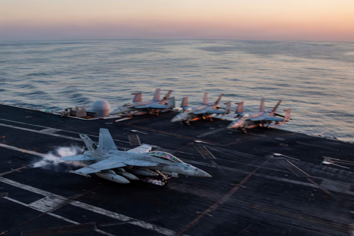 This image provided by U.S. Central Command shows a F/A-18F Super Hornet preparing to make an arrested landing on the USS Abraham Lincoln (CVN 72) in support of Operation Epic Fury, on Saturday, Feb. 28, 2026.