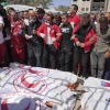 Mourners gather around the bodies of eight Red Crescent emergency responders, recovered in Rafah a week after an Israeli attack, as they are transported for burial from a hospital in Deir al-Balah, Gaza Strip, March 31. (AP Photo/Abdel Kareem Hana)