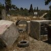 Concrete blocks placed by Israeli soldiers after October 7, 2023, according to local residents, are seen at one of the entrances of the village, impeding access for Palestinians in the West Bank village of Sinjil, Wednesday, July 9, 2025.