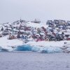 Homes covered by snow are seen from the sea in Nuuk, Greenland, on March 6, 2025. (AP Photo/Evgeniy Maloletka, File)