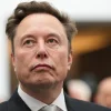 Elon Musk listens as President Donald Trump speaks during an event at the U.S. Institute of Peace, Oct. 8, 2026, in Washington.