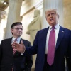 Ketua DPR Mike Johnson memandang Presiden Donald Trump ketika dia berbicara di dalam Capitol AS.