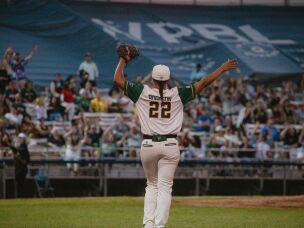 Sabrina Robinson, first basemen for the Boston Hunters, dances between innings to rile up the crowd during her team's first game in the Women's Pro Baseball League on Sunday, Aug. 2.
