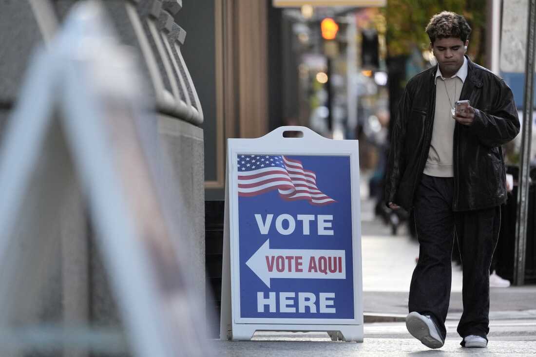 A man walks past a polling place at City Hall in Providence, R.I., on Nov. 5, 2024.